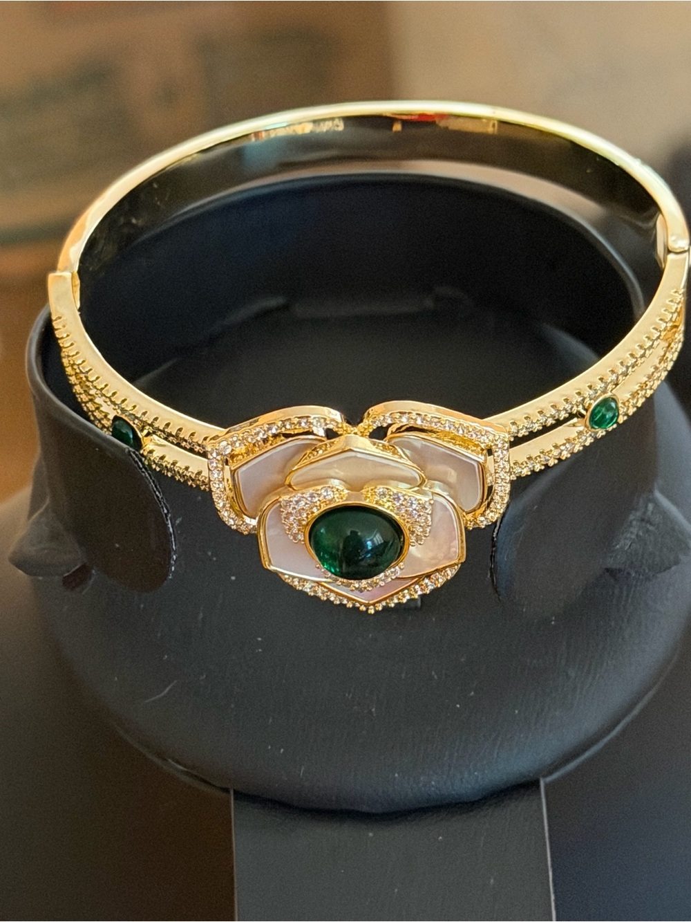 Gold Floral Bracelet with Green Gem Accent